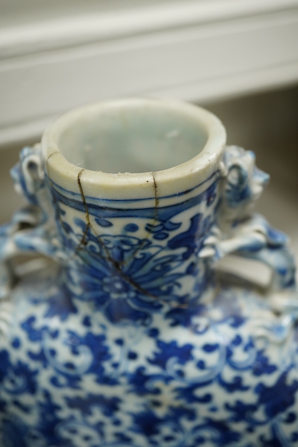A pair of late 19th century Chinese blue and white moon vases, 23cm. Condition - one vase poor